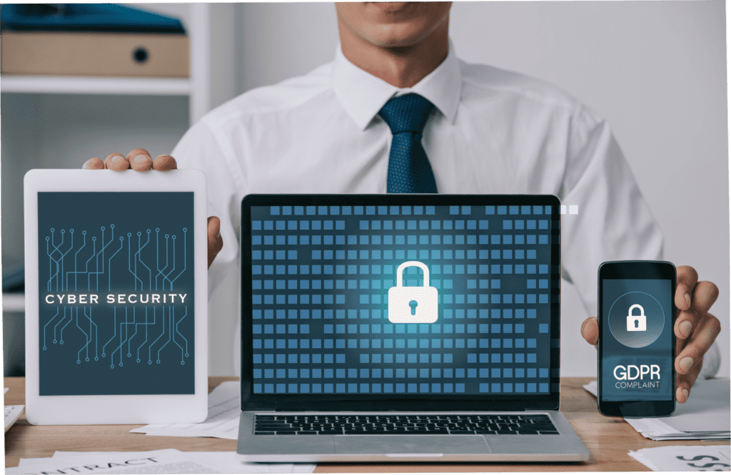 cropped shot of businessman showing laptop tablet.min